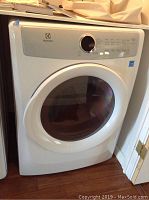 Overall front view of white Electrolux dryer