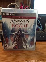 Front cover of Assassin's Creed Rogue Limited Edition PS3 game case with cover art showing hooded character in snowy environment.