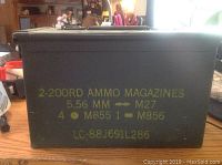Closed view of the green metal military ammo can with clear yellow stencil markings identifying ammo contents and specifications.