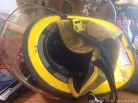 Side angle showing helmet interior padding and clear protective face shield