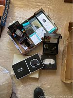Overview of Fitbit wristbands in boxes, Nike Fuelband SE, and accessories.