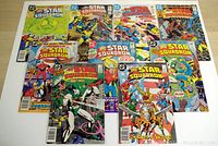 Photo showing 9 All Star Squadron comic books from DC Comics arranged in a grid. The issues included are #19, 21, 22, and 24 through 29, with colorful illustrated superhero covers.