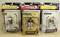 Three McFarlane NHL hockey figures in original packaging representing Ray Bourque, Dominik Hasek, and Jaromir Jagr shown fronted inside blister card.
