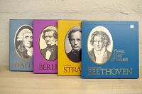 Front view of the four boxed record sets featuring Beethoven, Haydn, Berlioz, and Strauss with clear composer portraits and title on each box.