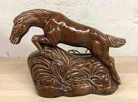 Front side view of the vintage ceramic horse TV lamp, showing full horse figurine detail and base.