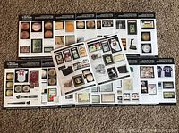 Multiple Hunt Sports Memorabilia auction catalogs spread out showing front covers and content pages featuring sports collectibles.