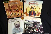 Four vintage marching band record albums arranged in a 2x2 grid showing front covers. Includes Famous Marches of Sousa, Hands Across the Sea, Elgar and Davis Pomp and Circumstance, and Royal Marines & Argyll Sutherland Highlanders albums.