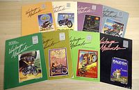 Top-down view of 8 Vintage Mounts magazines with colorful covers showing various antique motorcycles and motorcycle brands like AJS, BSA, Norton, and Raleigh