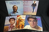 Five vinyl albums arranged on black background showing front covers of Pavarotti, Domingo, and Stuarti records.