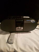 Front angle view of the Sony MEGABASS boombox with remote control placed in front.