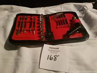 Image of open black zippered tool kit with red lining showing multiple socket wrenches and screwdriver bits organized inside