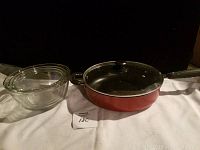 Three clear glass Anchor Ovenware baking dishes and one red non-stick pan with glass lid.