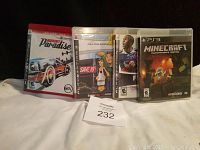Four PS3 game cases displayed in a row including Burnout Paradise, Shaun White Snowboarding, FIFA, and Minecraft PS3 Edition.