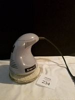 Front and side views of the Proelite buffer polisher showing brand label, ergonomic design, and fabric buffer pad.