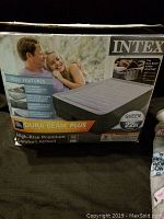 Front of the box showing INTEX queen size high-rise air mattress, Dura-Beam Plus, 22 inches high.