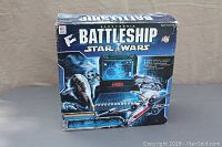 Front view of boxed Star Wars Electronic Battleship game showing featured artwork and game unit image