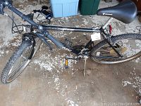Full side view of the Murray Nightwing mountain bike showing black frame, tires, and seat.