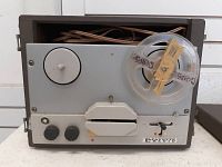 Front view of Lafayette reel-to-reel tape player showing one reel with tape and control knobs