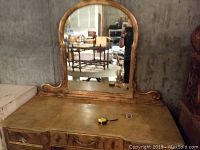Front view of dressing table with attached mirror