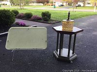 Photo showing adjustable fiberglass bed tray with metallic legs and Brandt mid century avocado green hexagonal table outdoors on asphalt driveway.