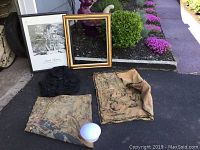 Photo showing all items in lot including the framed Ansel Adams print, black vest, two tapestries, and a white light fixture.