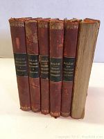 Front view of six antique Balzac hardcover books in poor condition with worn reddish-brown leather covers and black spine labels.