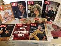 10 vintage Life magazines arranged in two rows showing various cover images including Marilyn Monroe, Richard Burton, a year in pictures 1972 edition, Julie Christie and others.