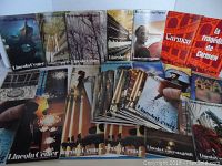 Photo showing a variety of Metropolitan Opera stagebills arranged in rows featuring multiple covers including images of opera scenes, Lincoln Center architecture, and iconic artwork.