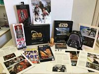 Photo shows entire Star Wars lot including book, DVD, metal box, action figures, mini figurines, magazine, valentines box, McDonald's toy and printed pages scattered