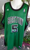 Green Adidas Kevin Garnett Boston Celtics basketball jersey size XL displayed on a mannequin, showing front with 'BOSTON' and number 5.