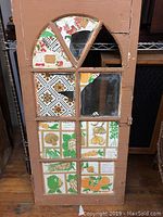 Front view showing full size and decorative panels within the window frame.