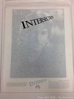 Photo of a promotional photo with 'Intersection' movie title and faded face in background