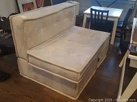 Front and side angle of twin sized loveseat sleeper sofa upholstery and overall dimensions