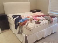 Full view of upholstered bed frame with soft fabric headboard, mattress and bedding not included.