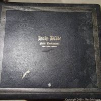 Black binder cover with gold lettering and border