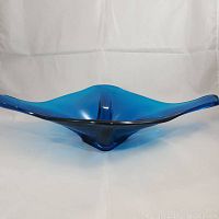 Front angle photo of the cobalt blue boat-shaped glass dish showing its glossy finish and shape on a white background.