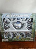 Full boxed children's tea set featuring teapot, six cups, and six saucers with Molly Brett fairy designs in original packaging