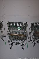 Front view of both metal planters side by side on white background