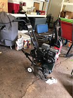 Full view of the Craftsman 3.75 HP tiller showing its frame, handles, and tines.
