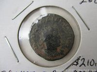 Obverse side showing profile of Emperor Gallienus with worn inscriptions on the coin