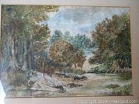 Frontal view of framed watercolor landscape showing full composition and frame