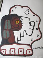 Close-up view of painted motif showing abstract head profile and color details