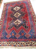 Full view of rug laid flat showing overall design and condition