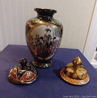 Front and side view of the oriental porcelain vase with detailed geisha paintings and two spare lids