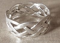 Close-up of the sterling silver Celtic knot design ring showing open weave pattern and 'Vivah' mark inside.