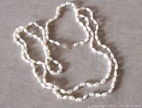 Full view of the freshwater pearl necklace showing the length and clasp detail