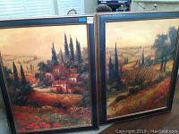 Both paintings shown side by side, each in dark frame featuring vineyard and Tuscan countryside scenes with trees and houses.
