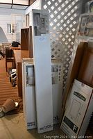 Several tall boxed Entry Point window blinds for steel doors including sidelite blind.