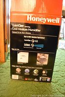 Box showing Honeywell QuietCare Cool Moisture Humidifier, highlights up to 4 gallons output per day and quiet operation.