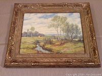 Full view of the antique framed springtime landscape print on neutral background.